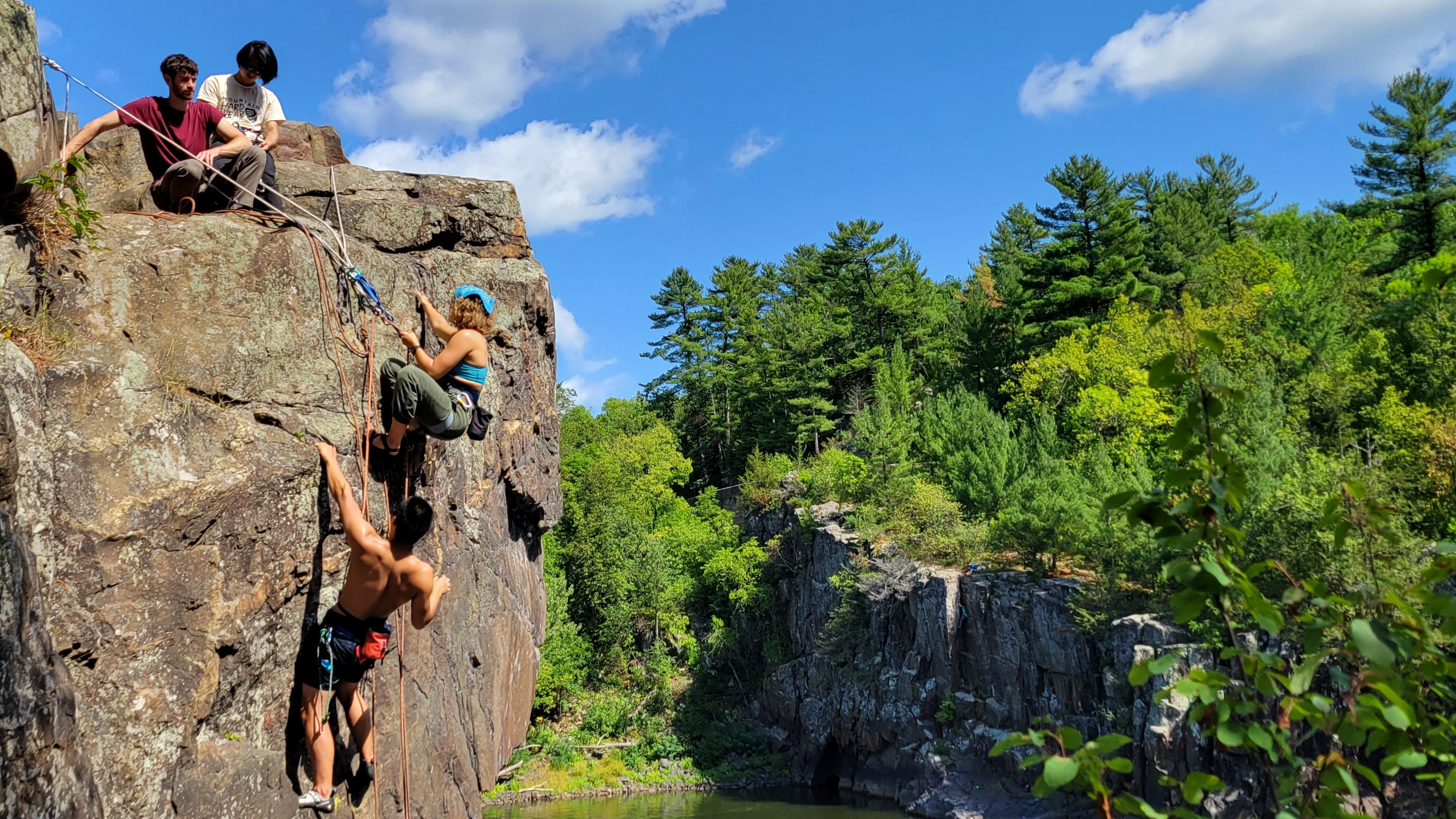 Charles Yang and some friends hanging off a cliff at Taylor Falls, Minnesota